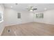 Spacious living room with hardwood floors, large windows, recessed lighting, and access to a backyard at 5000 Northland Sw Rd, Mableton, GA 30126