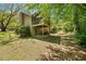 Home with a screened porch in a tree-filled private backyard at 7060 Steel Wood Nw Dr, Kennesaw, GA 30152
