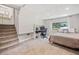Finished basement features carpeted stairs, drop ceiling, and an open layout perfect for a bedroom or office at 7060 Steel Wood Nw Dr, Kennesaw, GA 30152
