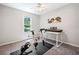 Bedroom features a ceiling fan, exercise bike, and keyboard at 7060 Steel Wood Nw Dr, Kennesaw, GA 30152