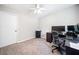 Bedroom with neutral paint, plush carpet, ceiling fan, and ample space for a work area at 7060 Steel Wood Nw Dr, Kennesaw, GA 30152