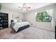 Comfortable bedroom with ceiling fan and lots of natural light at 7060 Steel Wood Nw Dr, Kennesaw, GA 30152