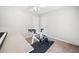 Well-lit bedroom with exercise bike, ceiling fan, and two closet doors at 7060 Steel Wood Nw Dr, Kennesaw, GA 30152