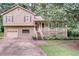Charming two-story home with a well-maintained lawn and a cozy front porch at 7060 Steel Wood Nw Dr, Kennesaw, GA 30152