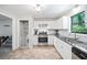 Well-lit kitchen featuring white cabinets, subway tile backsplash, and stainless steel appliances at 7060 Steel Wood Nw Dr, Kennesaw, GA 30152