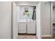 Convenient laundry closet features a washer and dryer, and ample storage space at 7060 Steel Wood Nw Dr, Kennesaw, GA 30152