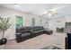 Cozy living room featuring plush carpeting, neutral tones, and abundant natural light at 7060 Steel Wood Nw Dr, Kennesaw, GA 30152