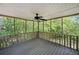 Relaxing screened porch with wooded views, perfect for enjoying the outdoors at 7060 Steel Wood Nw Dr, Kennesaw, GA 30152