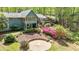 Back exterior showcasing tiered deck, screened porch, and manicured landscape at 175 Flat Creek Ct, Fayetteville, GA 30214