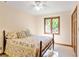 Cozy bedroom featuring a double bed, a decorative window, and neutral walls, creating a comfortable space at 175 Flat Creek Ct, Fayetteville, GA 30214