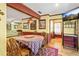 Inviting dining area with hardwood floors, warm paint tones, and a view to living room with comfortable sofa at 175 Flat Creek Ct, Fayetteville, GA 30214