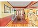 The dining area is bathed in natural light with hardwood flooring and convenient kitchen access with breakfast bar at 175 Flat Creek Ct, Fayetteville, GA 30214