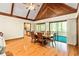Elegant dining room featuring hardwood floors, vaulted ceilings, and access to a screened porch at 175 Flat Creek Ct, Fayetteville, GA 30214