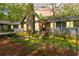 Charming home with stone accents, lovely landscaping, and a welcoming front entrance at 175 Flat Creek Ct, Fayetteville, GA 30214