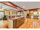 The kitchen showcases hardwood floors, a center island, and seamless connectivity to the home's living spaces at 175 Flat Creek Ct, Fayetteville, GA 30214