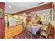 Charming kitchen and dining area with wood floors, decorative accents, and cozy ambiance at 175 Flat Creek Ct, Fayetteville, GA 30214