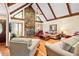 Spacious living room featuring a stone fireplace, vaulted ceilings, and hardwood floors at 175 Flat Creek Ct, Fayetteville, GA 30214