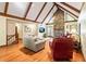 Bright living room featuring vaulted ceilings, a stone fireplace, and access to outdoor spaces at 175 Flat Creek Ct, Fayetteville, GA 30214