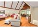 Open-concept living area with hardwood floors, vaulted ceilings, and seamless flow to dining at 175 Flat Creek Ct, Fayetteville, GA 30214