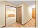 Inviting living room featuring wood floors, a comfortable sofa, and an open doorway, creating a welcoming atmosphere at 175 Flat Creek Ct, Fayetteville, GA 30214