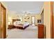 Generously sized main bedroom features neutral carpeting, a ceiling fan, and natural light streaming through the windows at 175 Flat Creek Ct, Fayetteville, GA 30214