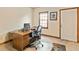 Functional office space with a desk, chair, and a window providing natural light, perfect for work or study at 175 Flat Creek Ct, Fayetteville, GA 30214