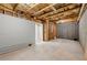 Spacious unfinished basement with exposed ceiling, concrete floor, and walkout access at 2238 Well Springs Dr, Buford, GA 30519