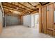 Spacious unfinished basement with exposed ceiling, concrete floor, and walkout access at 2238 Well Springs Dr, Buford, GA 30519