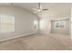 Bright, carpeted primary bedroom with a vaulted ceiling and windows allowing ample light at 2238 Well Springs Dr, Buford, GA 30519