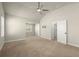 Bright, carpeted primary bedroom with a vaulted ceiling and windows allowing ample light at 2238 Well Springs Dr, Buford, GA 30519
