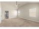 Spacious primary bedroom featuring neutral carpet, vaulted ceiling, and natural light at 2238 Well Springs Dr, Buford, GA 30519