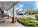 Welcoming front porch with brick accents and lush landscaping, creating a cozy outdoor space at 2238 Well Springs Dr, Buford, GA 30519