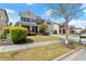 Inviting two-story home boasts a green lawn, charming landscaping, and a convenient two-car garage at 2238 Well Springs Dr, Buford, GA 30519
