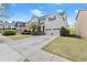 Traditional two-story home with a well-kept lawn, driveway, and an attached two-car garage at 2238 Well Springs Dr, Buford, GA 30519