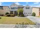 Charming two-story home featuring a well-manicured lawn, landscaped beds, and a two-car garage at 2238 Well Springs Dr, Buford, GA 30519