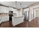 Modern kitchen with white cabinetry, a granite island, stainless appliances and plenty of natural light at 2238 Well Springs Dr, Buford, GA 30519