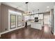 Open kitchen with white cabinets, granite countertops, stainless appliances, and a view of the patio at 2238 Well Springs Dr, Buford, GA 30519