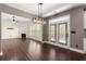 Open living and kitchen concept with granite island, stainless appliances, fireplace and backyard views at 2238 Well Springs Dr, Buford, GA 30519