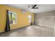 Bright, spacious living room with modern ceiling fan and natural lighting at 2238 Well Springs Dr, Buford, GA 30519