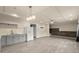 Living space with kitchenette, white cabinets, and durable wood-look flooring at 2238 Well Springs Dr, Buford, GA 30519
