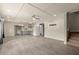 Spacious living room with an open floor plan, wood look floors, and kitchenette at 2238 Well Springs Dr, Buford, GA 30519