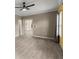Open living room with ceiling fan and neutral walls and flooring at 2238 Well Springs Dr, Buford, GA 30519