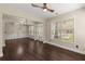 Open-concept living room with wood floors, stylish lighting, and a welcoming entrance at 2238 Well Springs Dr, Buford, GA 30519
