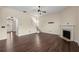 Living room with hardwood floors, fireplace, and staircase leading to the second floor at 2238 Well Springs Dr, Buford, GA 30519