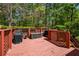 Relaxing back deck surrounded by lush trees, with space for outdoor grilling and entertaining at 2261 Byron Sw Ct, Marietta, GA 30064