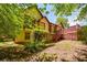 Picturesque backyard view of a home with a spacious deck, surrounded by lush greenery at 2261 Byron Sw Ct, Marietta, GA 30064