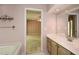A bathroom with double sinks and access to the Primary bedroom at 2261 Byron Sw Ct, Marietta, GA 30064