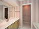 A bathroom with double sinks, wood cabinets, and a separate room for the toilet at 2261 Byron Sw Ct, Marietta, GA 30064