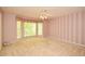 The Primary bedroom features large bay windows and striped wallpaper at 2261 Byron Sw Ct, Marietta, GA 30064