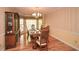 Formal dining room with hardwood floors, elegant chandelier, and classic wooden furniture for sophisticated dining at 2261 Byron Sw Ct, Marietta, GA 30064